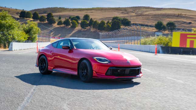 A red 2024 Nissan Z Nismo is parked on Sonoma Raceway in California